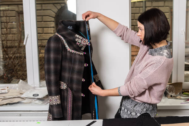 Seamstress works in the tailoring workshop